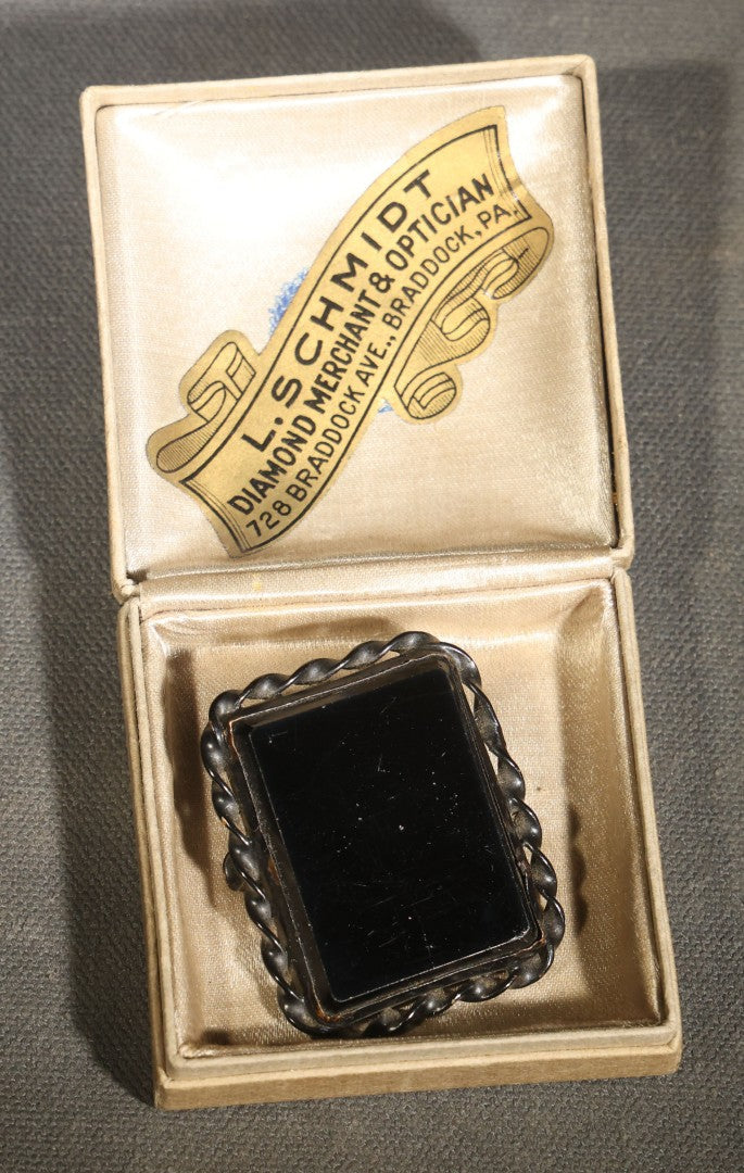 Antique Black Glass Mourning Brooch with Twisted Rope Border in L. Schmidt Diamond Merchant & Optician Jeweler's Box, Braddock, Pennsylvania