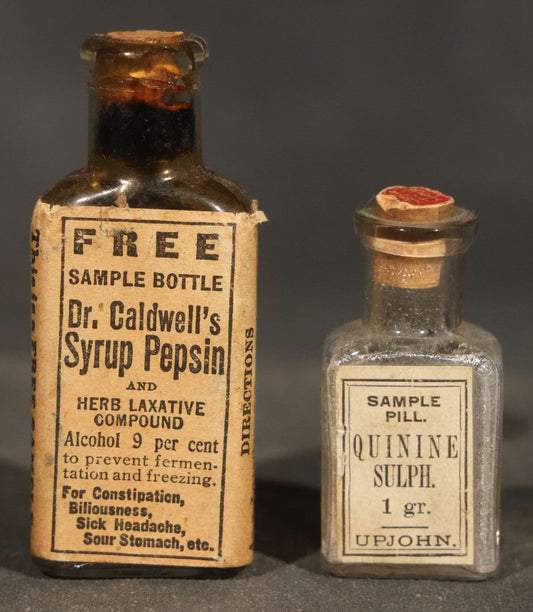 Pair of Antique Pharmaceutical Sample Bottles including Dr. Caldwell's Syrup Pepsin and Upjohn Quinine Sulph. Sample Pill