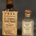 Lot 068 - Pair of Antique Pharmaceutical Sample Bottles Including Dr. Caldwell's Syrup Pepsin and Upjohn Quinine Sulph. Sample Pill