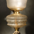 Lot 107 - Antique Figural Bust Oil Lamp with Pressed Glass Font, Ruffled Frosted Shade, and Glass Chimney, 20-1/2" H