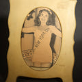 Lot 114 - Vintage Celluloid Easel-Back Frame with Oval Opening, Containing "Miss New York City" Beauty Pageant Newspaper Clipping, 4-3/4" W x 6" H