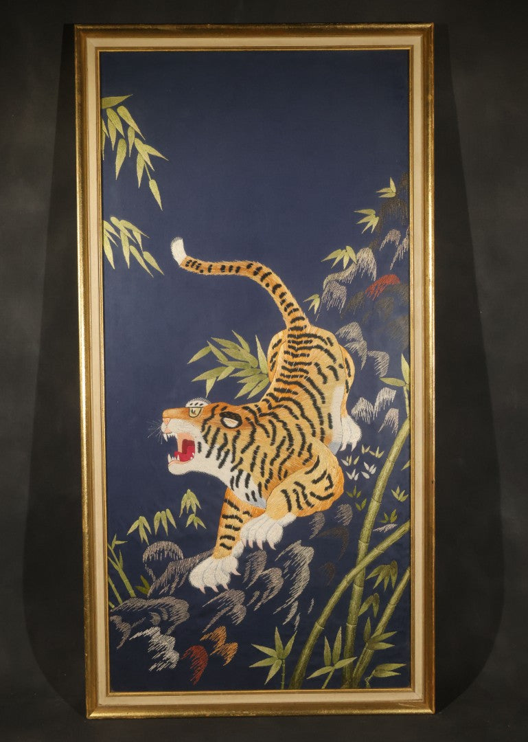 Vintage Framed Japanese Silk Embroidery of a Roaring Tiger Among Bamboo and Rocks on Navy Ground, Inscribed on Verso March 29, 1976