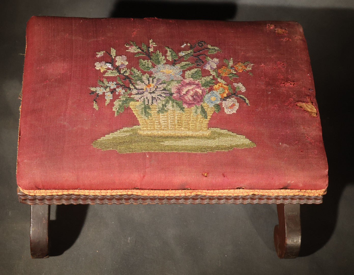 Antique Empire-Style Needlepoint Upholstered Footstool with Floral Basket Motif and Scrolled Legs