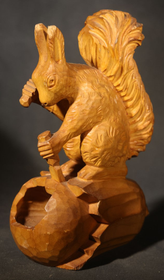 Vintage Hand-Carved Wood Folk Art Squirrel Figure Depicted Carving a Nut Shell with Mallet and Chisel