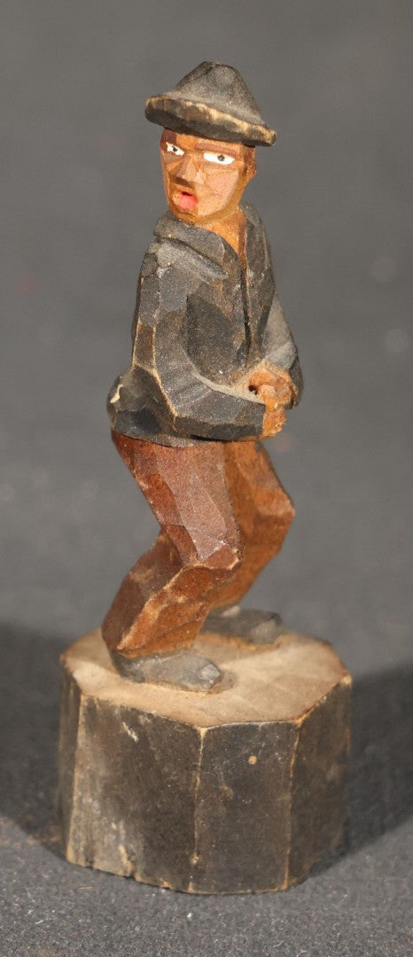 Trio of Antique Carved Wood Figures including a Penguin, a Painted Man in Cap and Jacket, and a Dark-Stained Anthropomorphic Figure