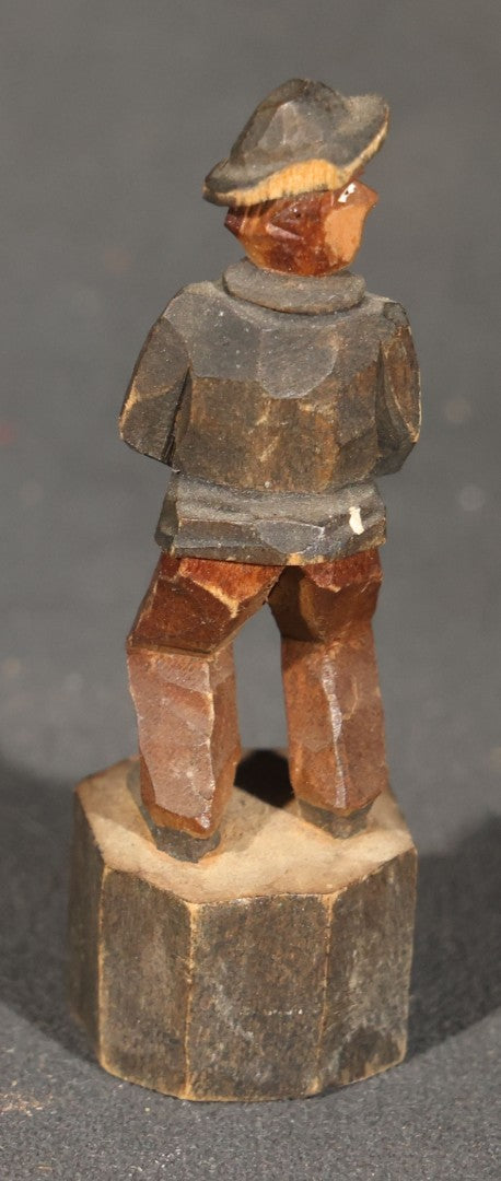 Trio of Antique Carved Wood Figures including a Penguin, a Painted Man in Cap and Jacket, and a Dark-Stained Anthropomorphic Figure