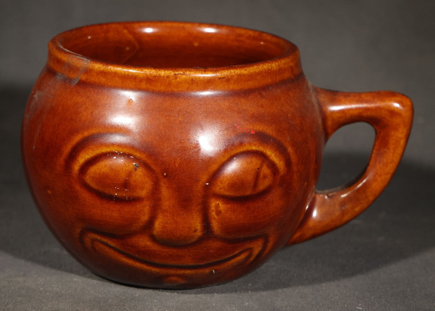 Trio of Vintage Figural Face Ceramics including Brown Glazed Smiley Mug, Anthropomorphic Tomato Jug with Lid, and Czechoslovakia Porcelanit Smiling Face Mug