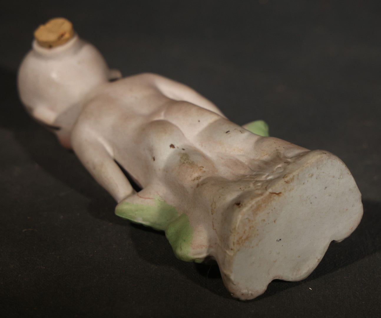 Antique German Bisque Figurine of a Baby Holding a Green Leaf Inscribed "Guess What I Am"