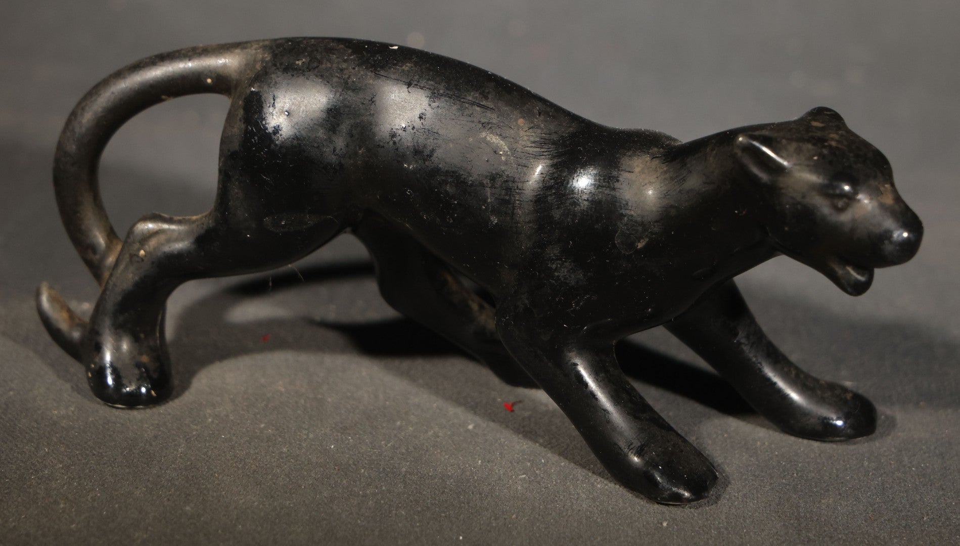 Trio of Vintage Porcelain Figures including Red Bulldog, Black Stalking Panther, and Dog with Dice