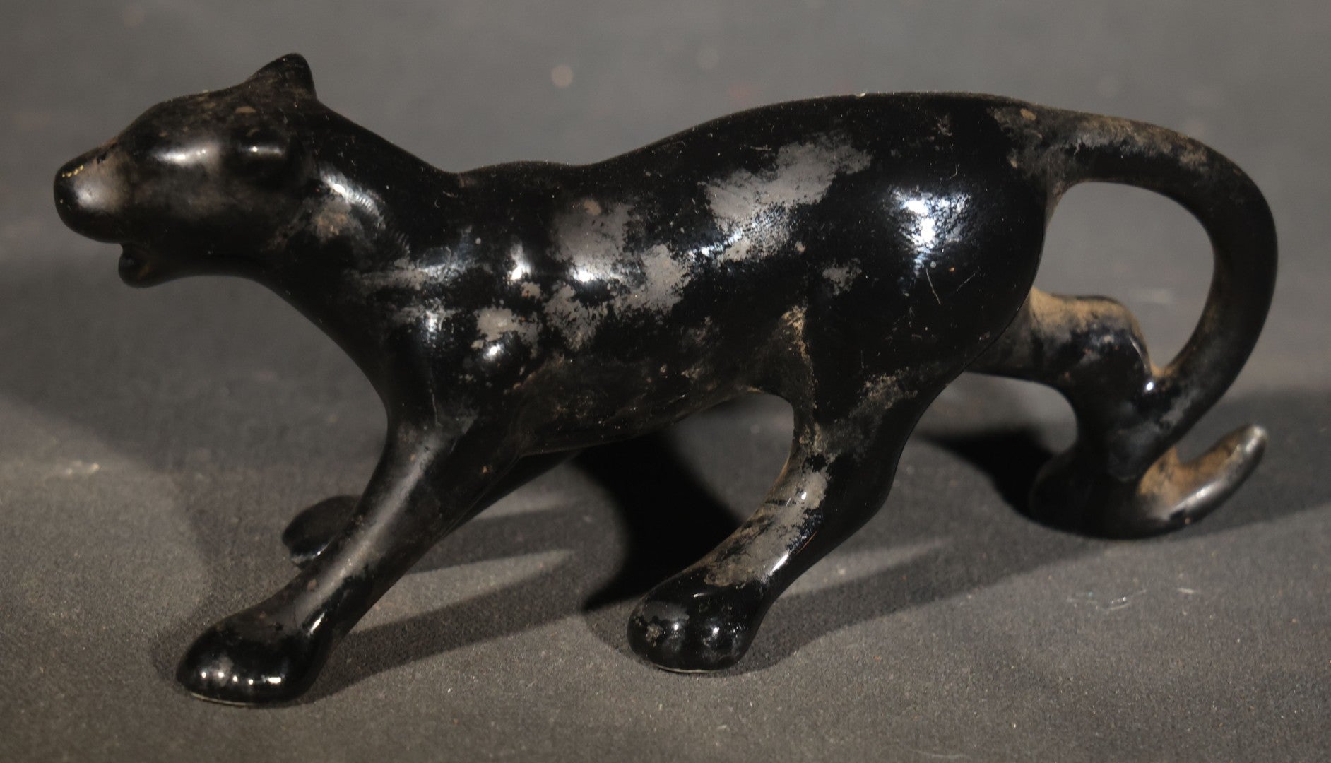 Trio of Vintage Porcelain Figures including Red Bulldog, Black Stalking Panther, and Dog with Dice