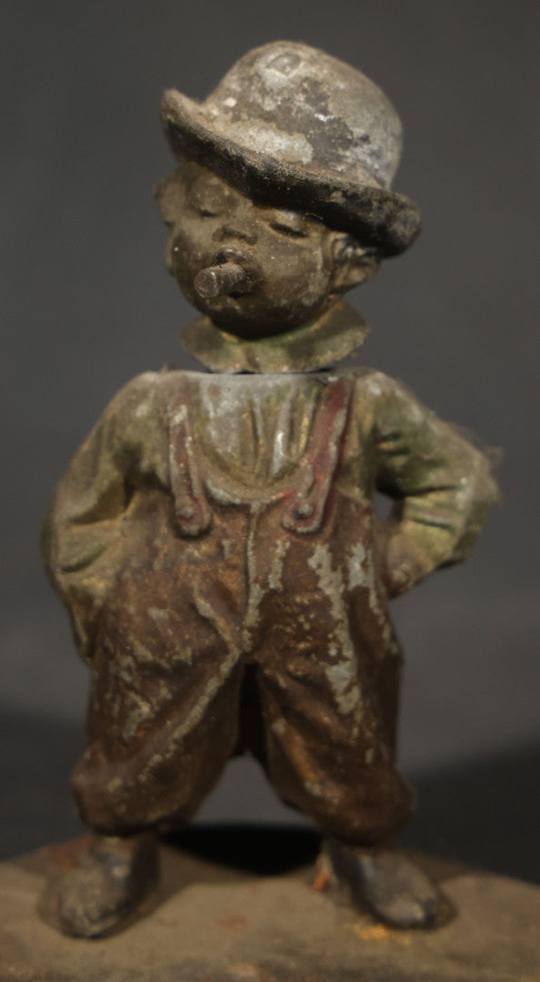 Antique Austrian Cold-Painted Metal Figural Nodder Ashtray Depicting a smoking Boy in Overalls and Hat, Marked Austria