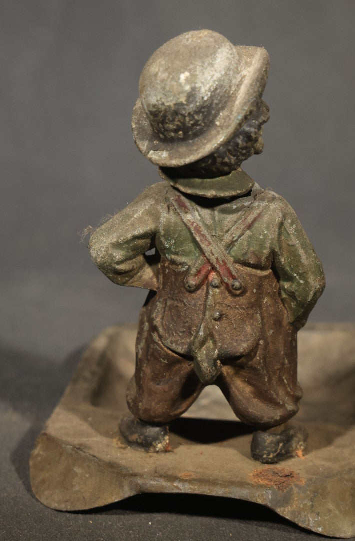 Antique Austrian Cold-Painted Metal Figural Nodder Ashtray Depicting a smoking Boy in Overalls and Hat, Marked Austria