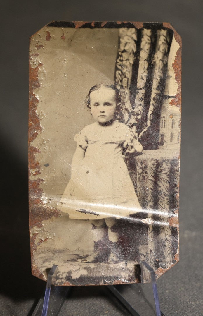 Pair of Antique Tintype Photographs of the Same Young Girl including One Holding a Doll