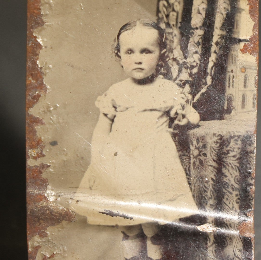 Pair of Antique Tintype Photographs of the Same Young Girl including One Holding a Doll
