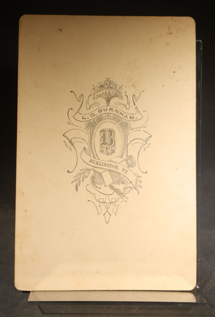 Grouping of Four Antique Photographs and Ephemera including Two Cabinet Card Photographs, a Board-Mounted Photograph of a House with Figures, and a Gibson Santa Claus Christmas Card