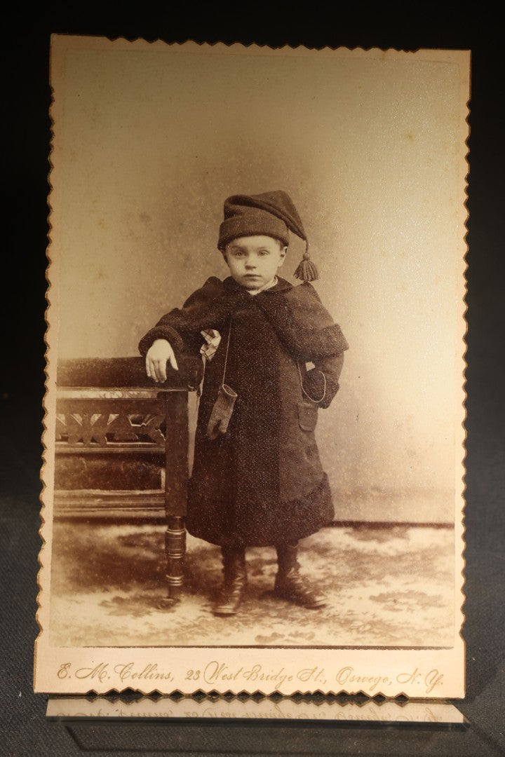 Grouping of Four Antique Photographs and Ephemera including Two Cabinet Card Photographs, a Board-Mounted Photograph of a House with Figures, and a Gibson Santa Claus Christmas Card