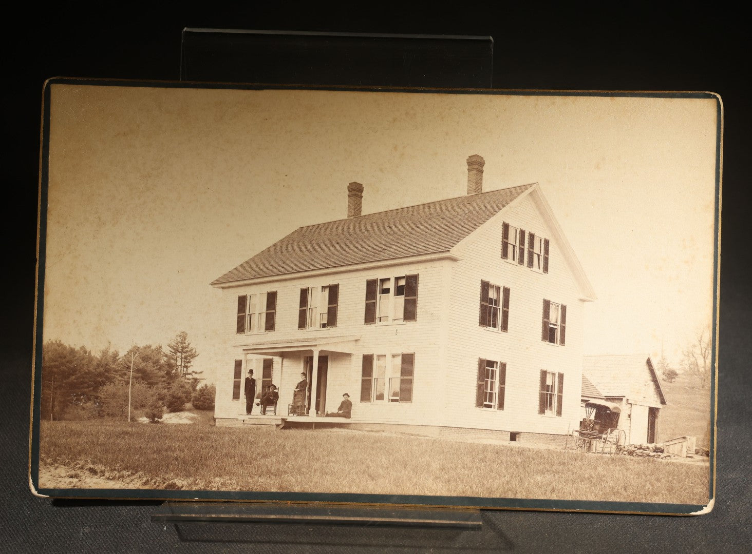 Grouping of Four Antique Photographs and Ephemera including Two Cabinet Card Photographs, a Board-Mounted Photograph of a House with Figures, and a Gibson Santa Claus Christmas Card