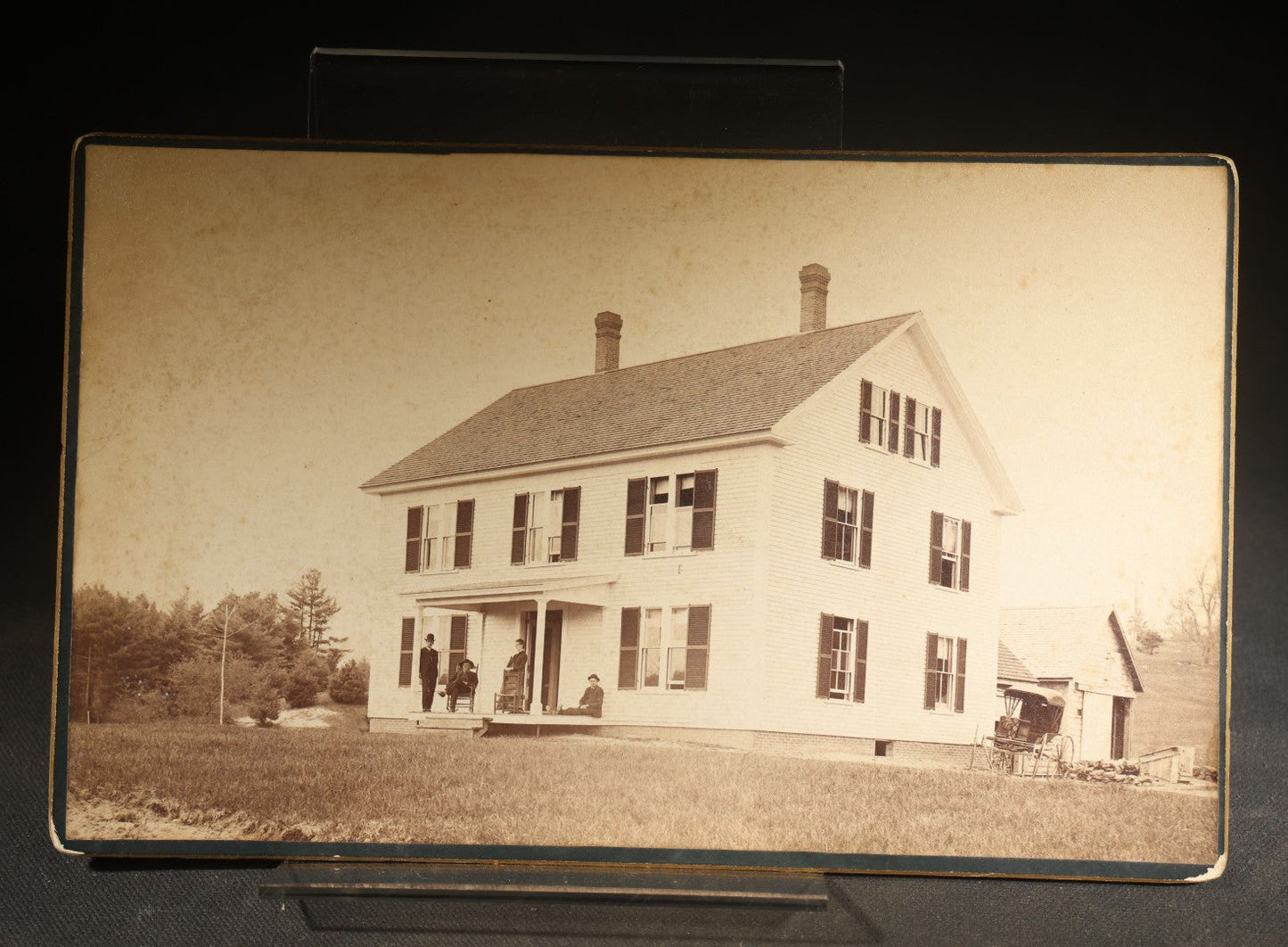 Grouping of Four Antique Photographs and Ephemera including Two Cabinet Card Photographs, a Board-Mounted Photograph of a House with Figures, and a Gibson Santa Claus Christmas Card