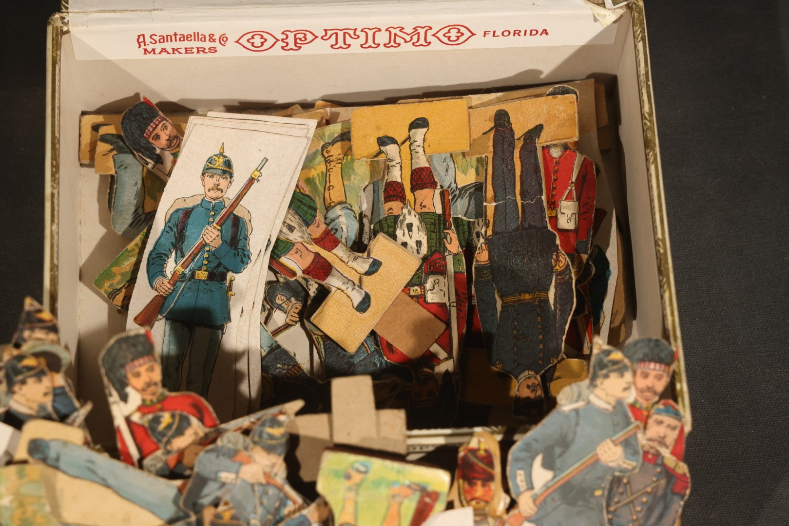 Grouping of Antique and Vintage Paper Soldiers and Military Figures including Chromolithograph Cutout Infantry and Cavalry, "Paper Soldiers of the American Revolution" Book, and Valiant Miniatures Metal Figure Kits