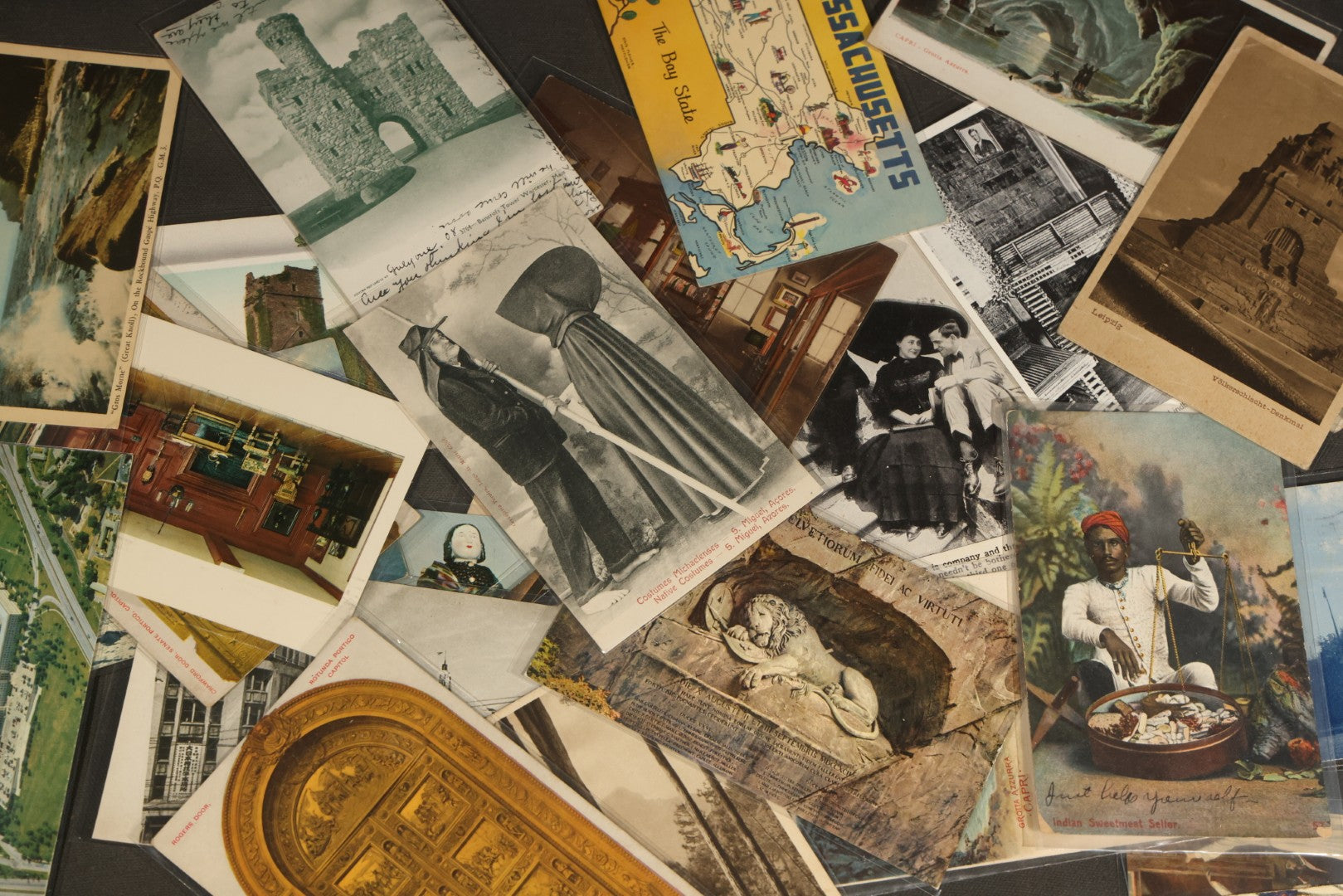 "Liza's Picks" Grouping of 30 Antique and Vintage Postcards including Massachusetts Map, Indian Sweetmeat Seller, Hebrew-Inscribed Cards, Castle Architecture, and Religious Subjects