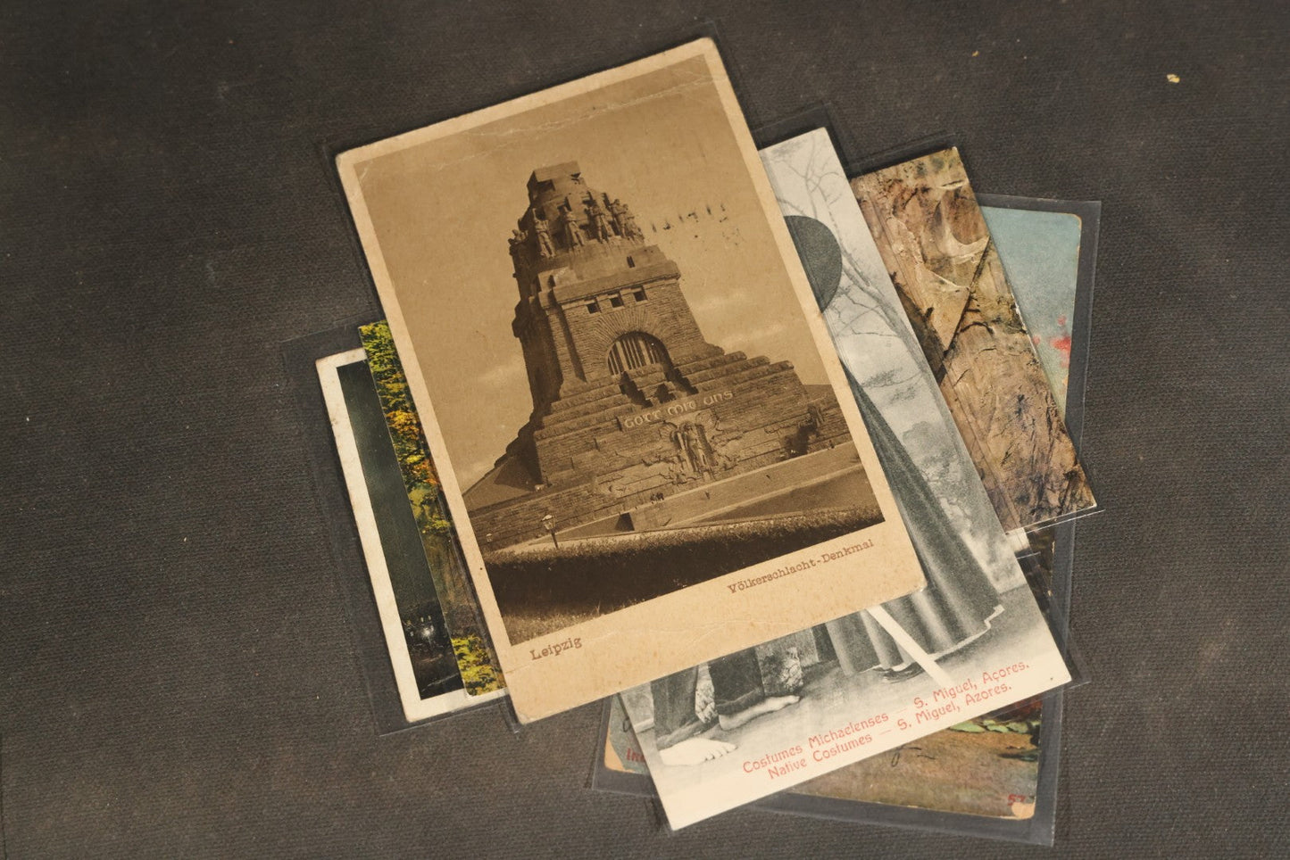 "Liza's Picks" Grouping of 30 Antique and Vintage Postcards including Massachusetts Map, Indian Sweetmeat Seller, Hebrew-Inscribed Cards, Castle Architecture, and Religious Subjects