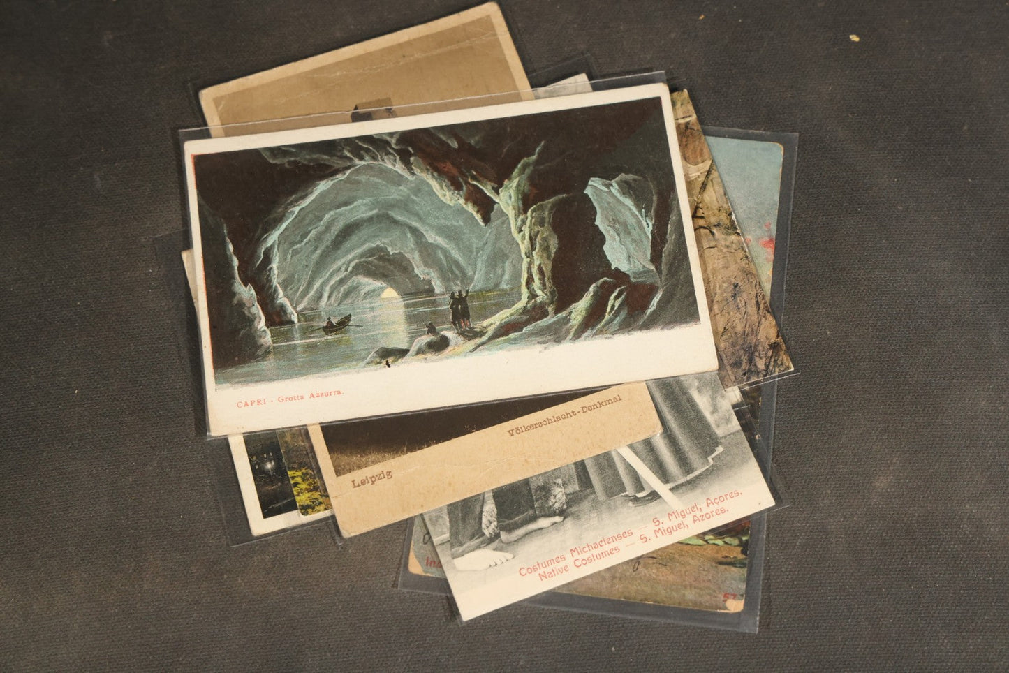 "Liza's Picks" Grouping of 30 Antique and Vintage Postcards including Massachusetts Map, Indian Sweetmeat Seller, Hebrew-Inscribed Cards, Castle Architecture, and Religious Subjects