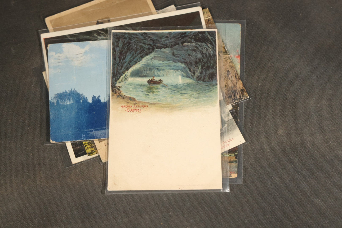 "Liza's Picks" Grouping of 30 Antique and Vintage Postcards including Massachusetts Map, Indian Sweetmeat Seller, Hebrew-Inscribed Cards, Castle Architecture, and Religious Subjects