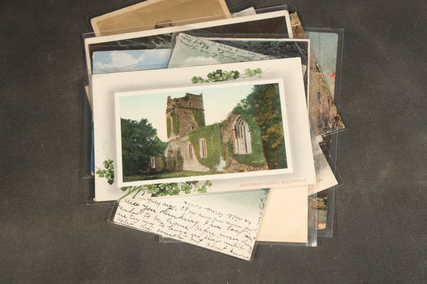 "Liza's Picks" Grouping of 30 Antique and Vintage Postcards including Massachusetts Map, Indian Sweetmeat Seller, Hebrew-Inscribed Cards, Castle Architecture, and Religious Subjects
