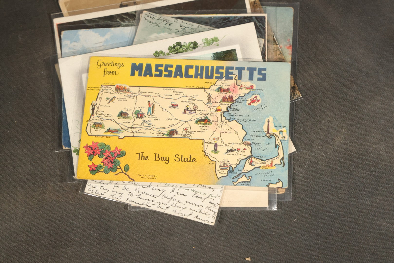 "Liza's Picks" Grouping of 30 Antique and Vintage Postcards including Massachusetts Map, Indian Sweetmeat Seller, Hebrew-Inscribed Cards, Castle Architecture, and Religious Subjects