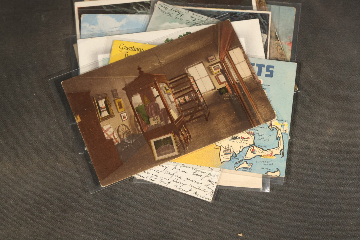 "Liza's Picks" Grouping of 30 Antique and Vintage Postcards including Massachusetts Map, Indian Sweetmeat Seller, Hebrew-Inscribed Cards, Castle Architecture, and Religious Subjects
