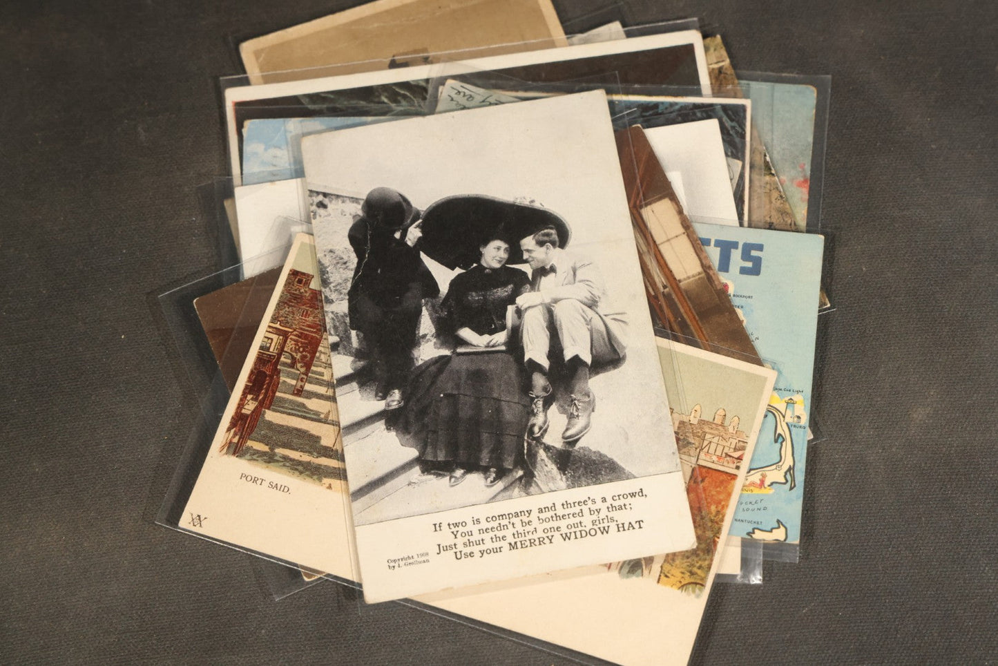 "Liza's Picks" Grouping of 30 Antique and Vintage Postcards including Massachusetts Map, Indian Sweetmeat Seller, Hebrew-Inscribed Cards, Castle Architecture, and Religious Subjects