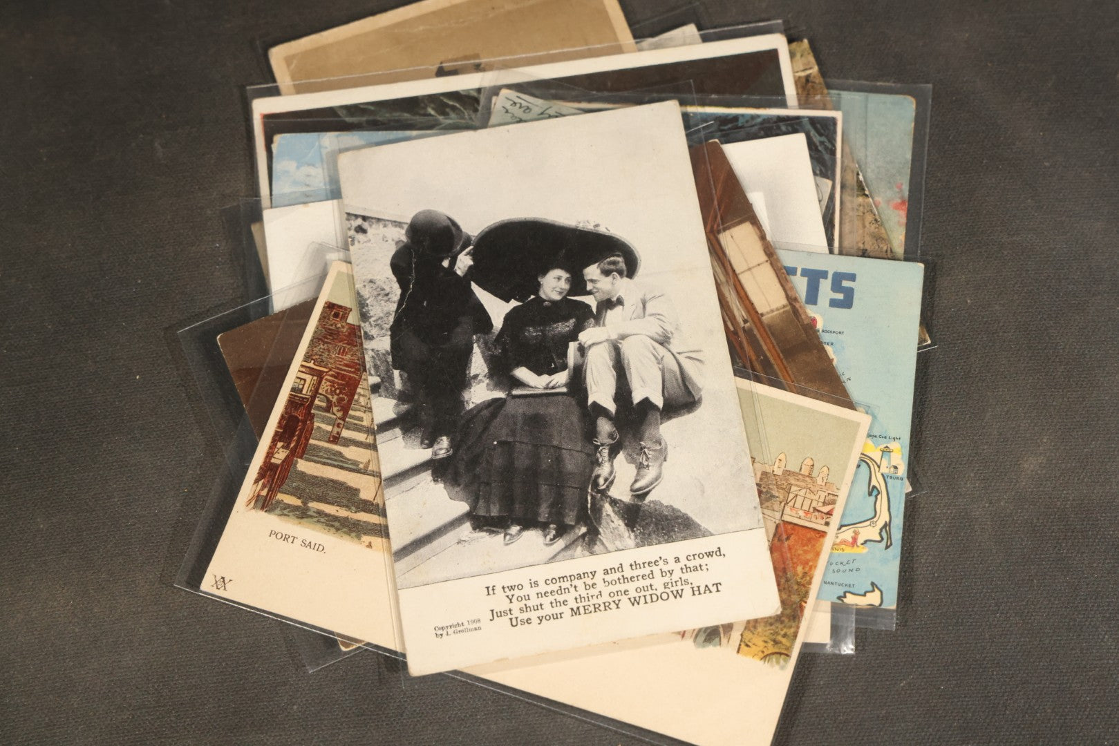 "Liza's Picks" Grouping of 30 Antique and Vintage Postcards including Massachusetts Map, Indian Sweetmeat Seller, Hebrew-Inscribed Cards, Castle Architecture, and Religious Subjects