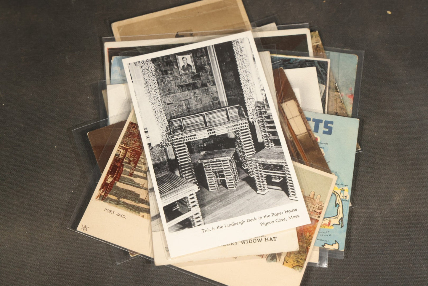 "Liza's Picks" Grouping of 30 Antique and Vintage Postcards including Massachusetts Map, Indian Sweetmeat Seller, Hebrew-Inscribed Cards, Castle Architecture, and Religious Subjects