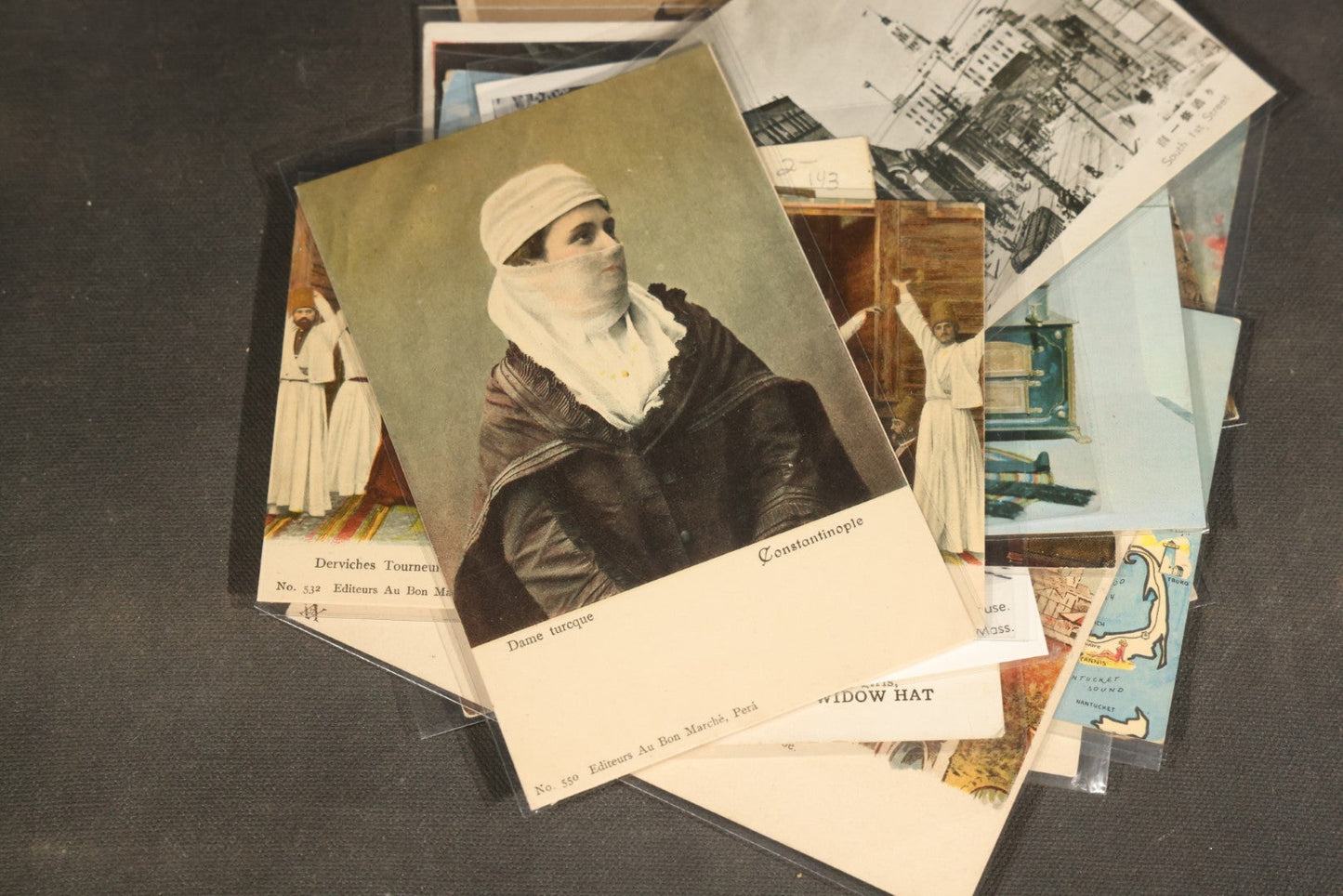 "Liza's Picks" Grouping of 30 Antique and Vintage Postcards including Massachusetts Map, Indian Sweetmeat Seller, Hebrew-Inscribed Cards, Castle Architecture, and Religious Subjects