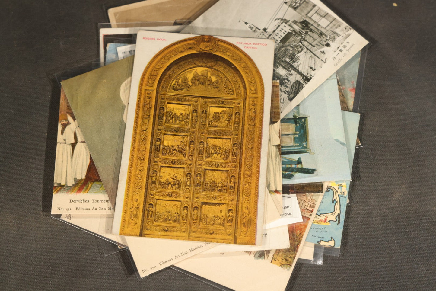 "Liza's Picks" Grouping of 30 Antique and Vintage Postcards including Massachusetts Map, Indian Sweetmeat Seller, Hebrew-Inscribed Cards, Castle Architecture, and Religious Subjects