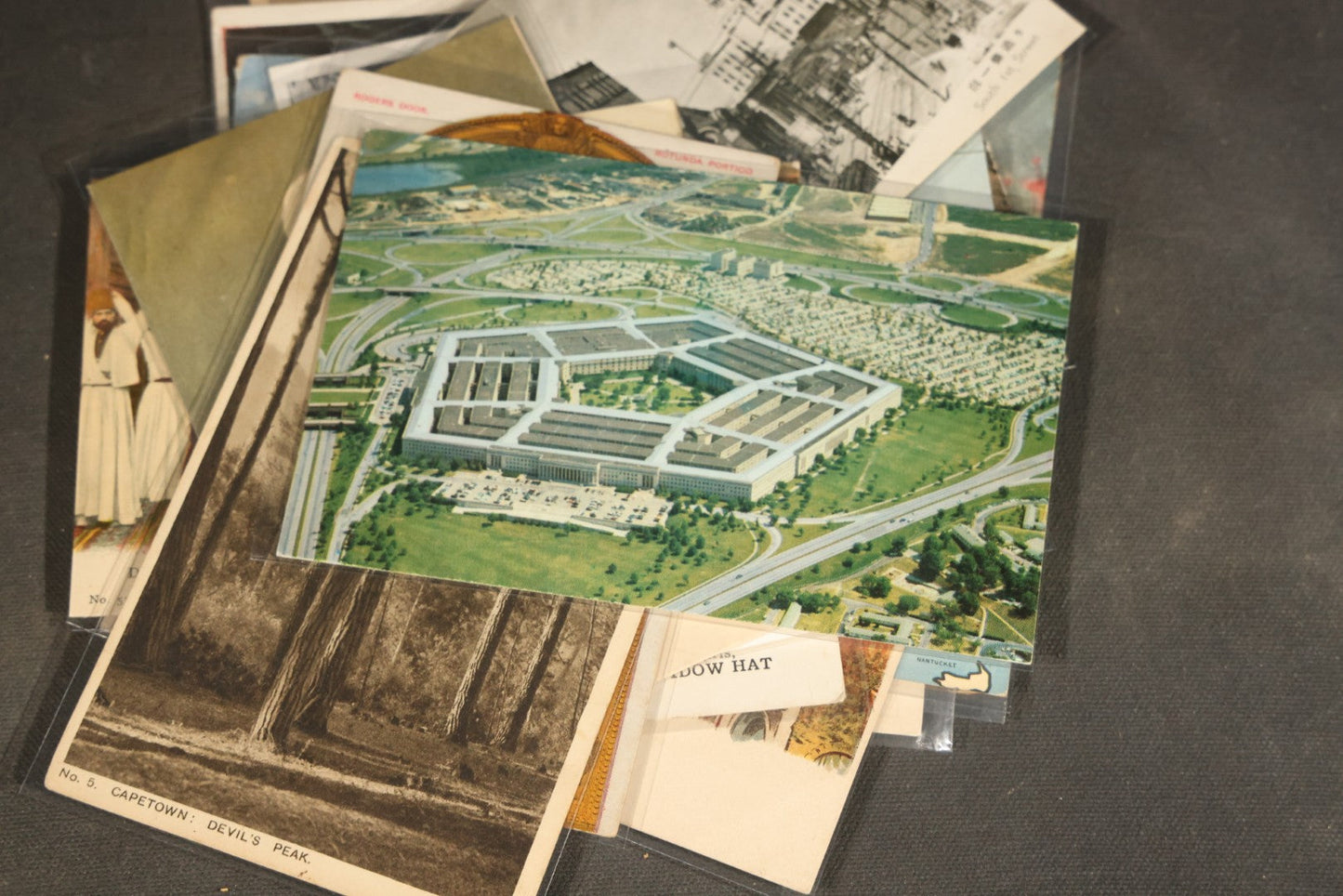 "Liza's Picks" Grouping of 30 Antique and Vintage Postcards including Massachusetts Map, Indian Sweetmeat Seller, Hebrew-Inscribed Cards, Castle Architecture, and Religious Subjects