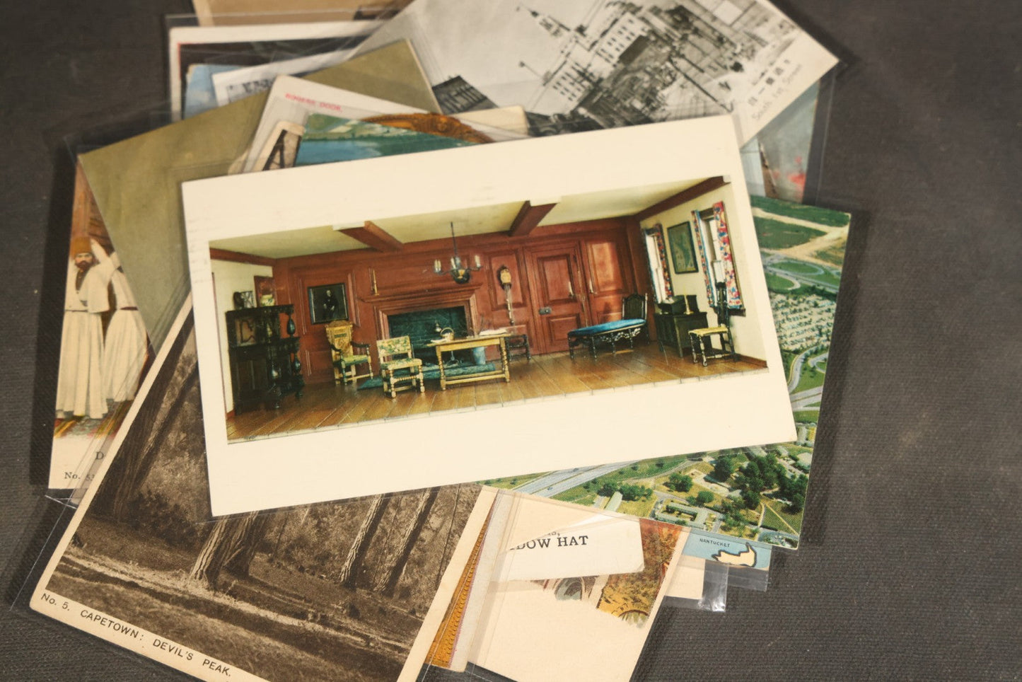 "Liza's Picks" Grouping of 30 Antique and Vintage Postcards including Massachusetts Map, Indian Sweetmeat Seller, Hebrew-Inscribed Cards, Castle Architecture, and Religious Subjects