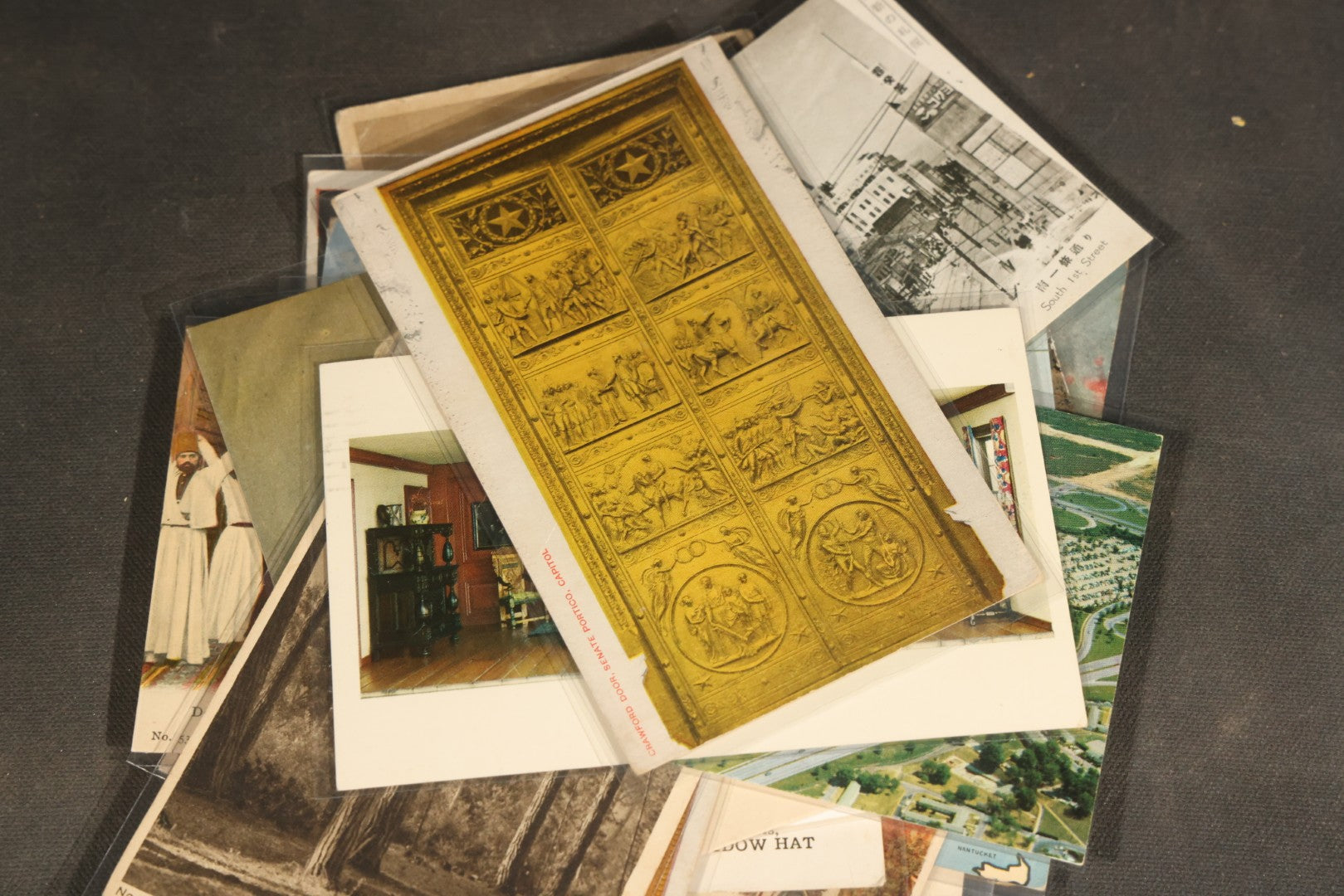 "Liza's Picks" Grouping of 30 Antique and Vintage Postcards including Massachusetts Map, Indian Sweetmeat Seller, Hebrew-Inscribed Cards, Castle Architecture, and Religious Subjects