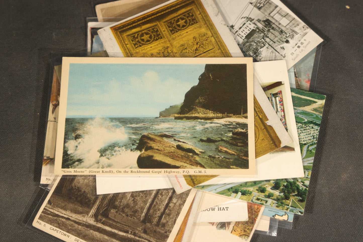 "Liza's Picks" Grouping of 30 Antique and Vintage Postcards including Massachusetts Map, Indian Sweetmeat Seller, Hebrew-Inscribed Cards, Castle Architecture, and Religious Subjects