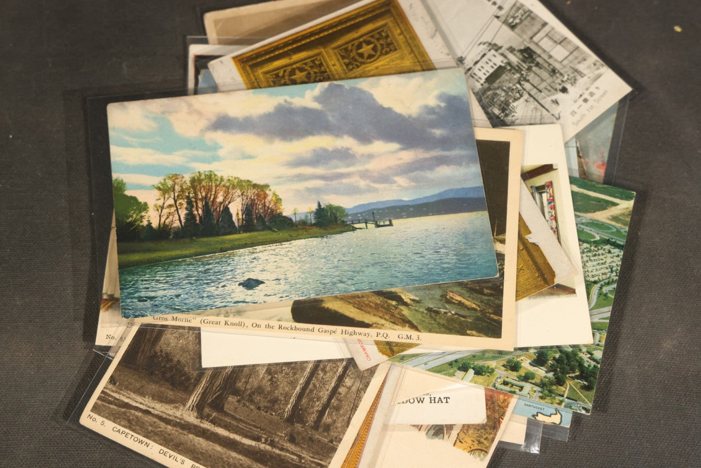 "Liza's Picks" Grouping of 30 Antique and Vintage Postcards including Massachusetts Map, Indian Sweetmeat Seller, Hebrew-Inscribed Cards, Castle Architecture, and Religious Subjects
