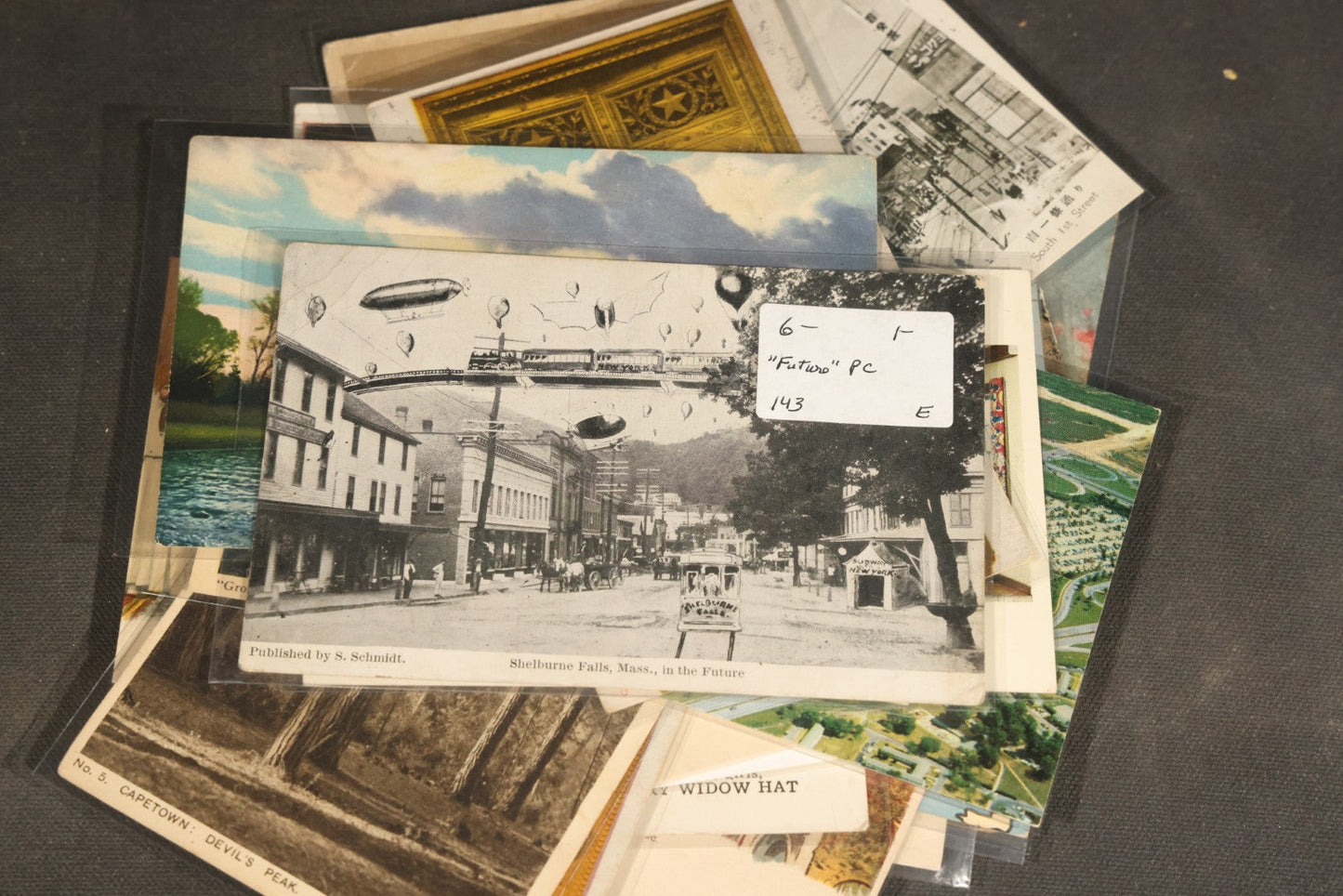 "Liza's Picks" Grouping of 30 Antique and Vintage Postcards including Massachusetts Map, Indian Sweetmeat Seller, Hebrew-Inscribed Cards, Castle Architecture, and Religious Subjects