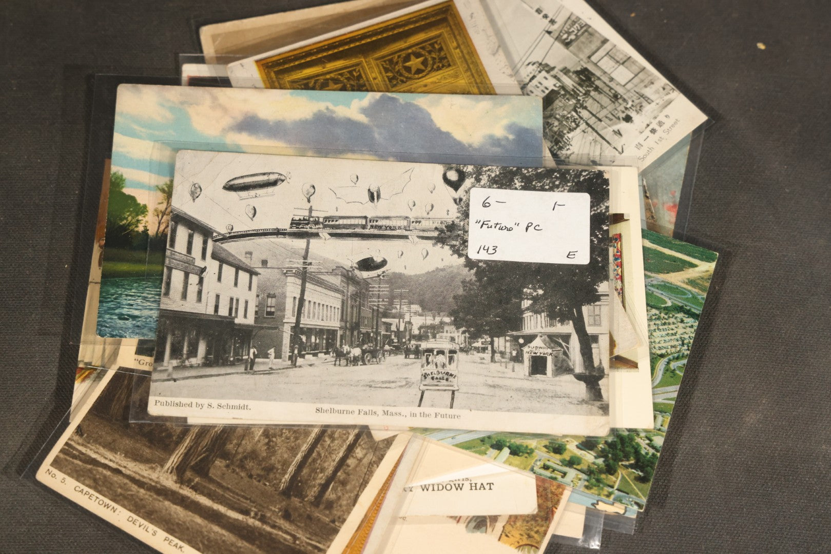 "Liza's Picks" Grouping of 30 Antique and Vintage Postcards including Massachusetts Map, Indian Sweetmeat Seller, Hebrew-Inscribed Cards, Castle Architecture, and Religious Subjects