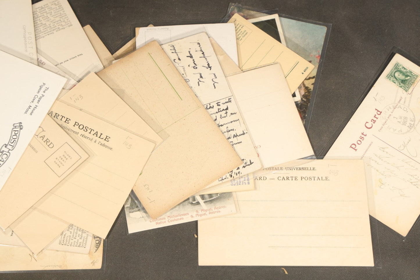 "Liza's Picks" Grouping of 30 Antique and Vintage Postcards including Massachusetts Map, Indian Sweetmeat Seller, Hebrew-Inscribed Cards, Castle Architecture, and Religious Subjects