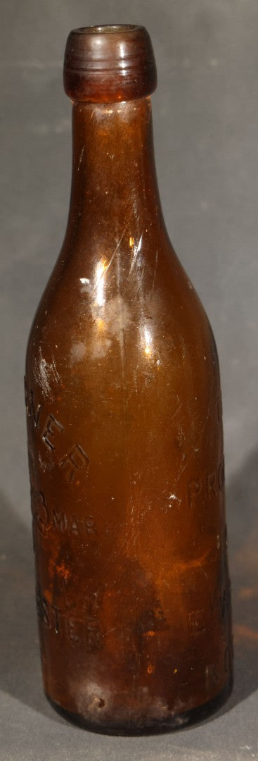 Grouping of Five Antique Embossed Glass Bottles including Moxie Nerve Food, Father John's Medicine, and Hood's Sarsaparilla