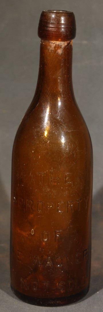 Grouping of Five Antique Embossed Glass Bottles including Moxie Nerve Food, Father John's Medicine, and Hood's Sarsaparilla