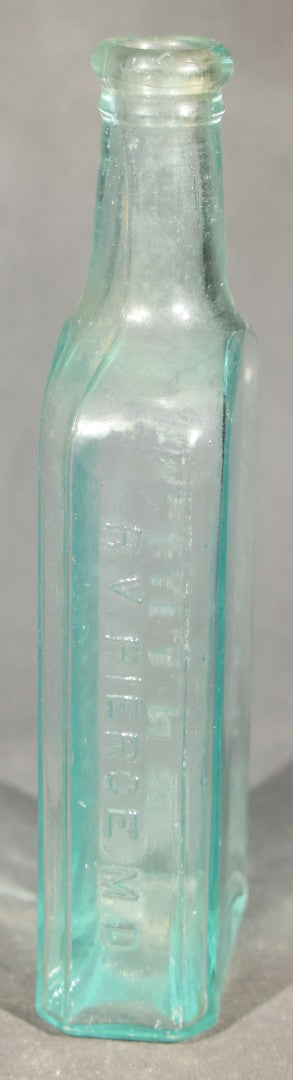 Grouping of Five Antique Embossed Glass Bottles including Moxie Nerve Food, Father John's Medicine, and Hood's Sarsaparilla