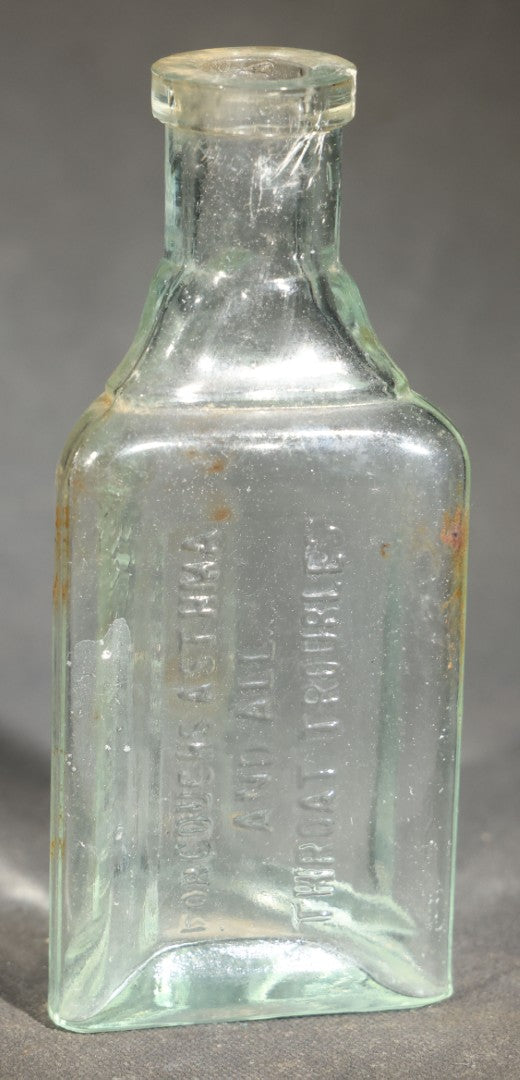 Grouping of Five Antique Embossed Glass Bottles including Remington and Gibbs Sulpho-Napthol