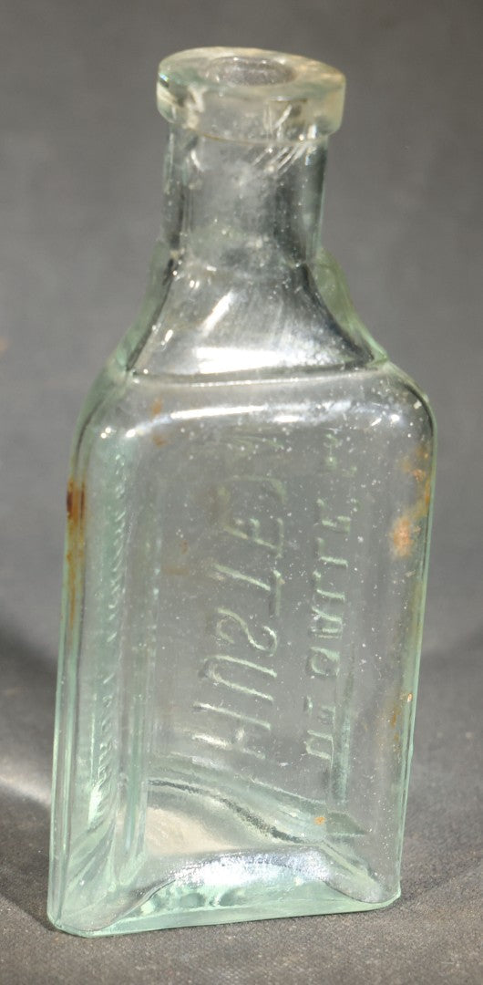 Grouping of Five Antique Embossed Glass Bottles including Remington and Gibbs Sulpho-Napthol