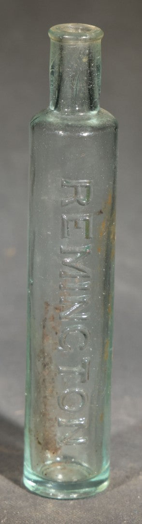Grouping of Five Antique Embossed Glass Bottles including Remington and Gibbs Sulpho-Napthol