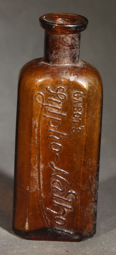 Grouping of Five Antique Embossed Glass Bottles including Remington and Gibbs Sulpho-Napthol